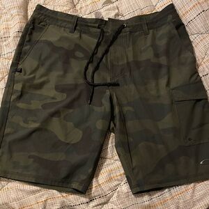 Oakley camouflage green shorts, size 38.